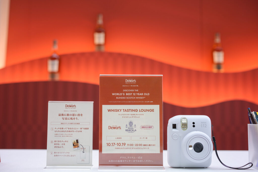 Guest capturing their Unexpected Chapter with a Polaroid keepsake